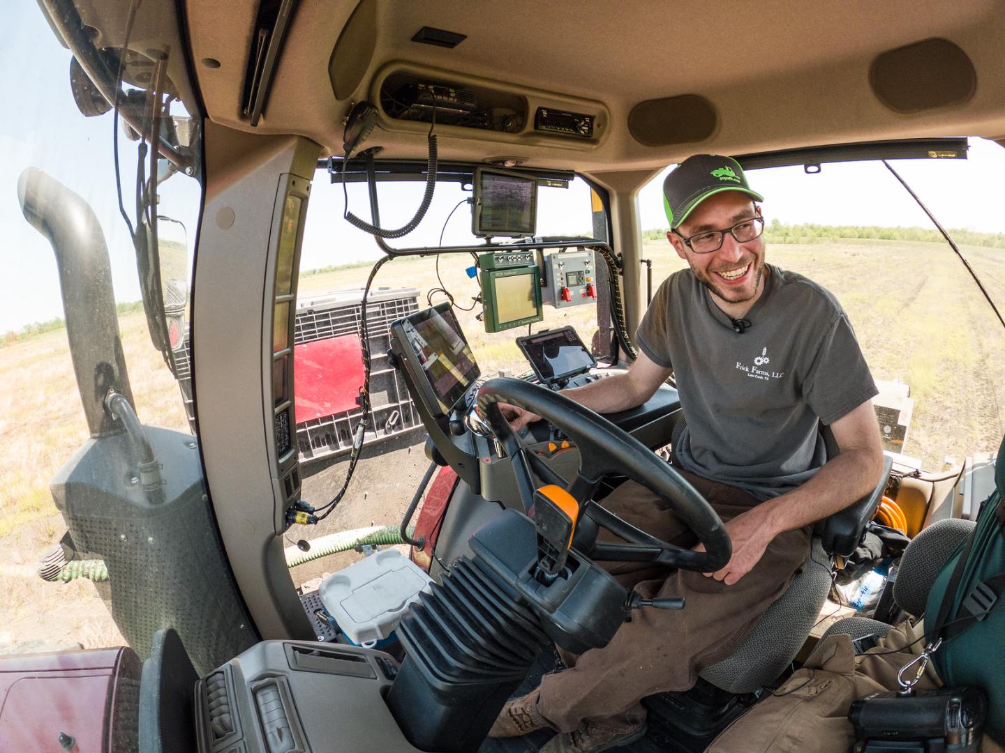 Alexander Frick, Jr. in his tractor/planter planting soybean seeds with the aid of precision agriculture systems and information, Alexander Frick, Jr., a.k.a. Alē, and his father Alexander Frick, Sr. are co-owners of Frick Farms, LLC, where they farm non-irrigated corn, soybeans, and wheat on more than 3,000 acres in northeast Texas, on April 13, 2021. In 2017 they began incorporating precision agriculture technology into their farming operation.. Their conservation practices include precision agriculture,