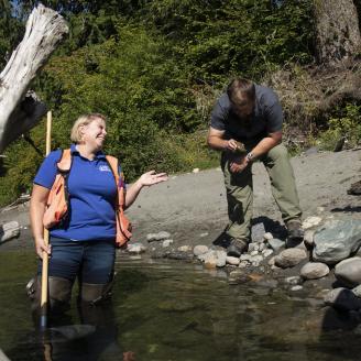 U.S. Department of Agriculture (USDA) Natural Resources Conservation Service (NRCS) Biologist Rachel Maggi and Resource Conservationist (Mount Vernon Field Office) Jared Hamman inspect a sample of aquatic insects as measure of habitat recovery near an engineered log jam structure in the Nooksack River, Washington, on August 7, 2019.


NRCS in Washington State works with Tribes and other salmon recovery partners to restore salmon habitat in the South Fork Nooksack River (Whatcom County, WA). NRCS has contrib