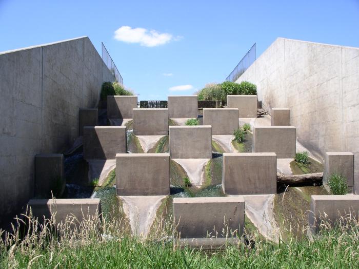 A baffled concrete chute spillway on a watershed dam.