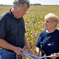 Virginia Reynolds meets with District Conservationist Dennis Schrodt to discuss her conservation plan.