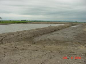An agricultural waste holding pond by a feedlot.